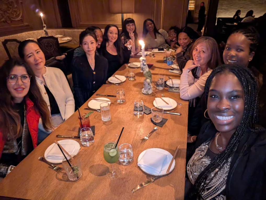 Guests gathered around a candlelit dinner table